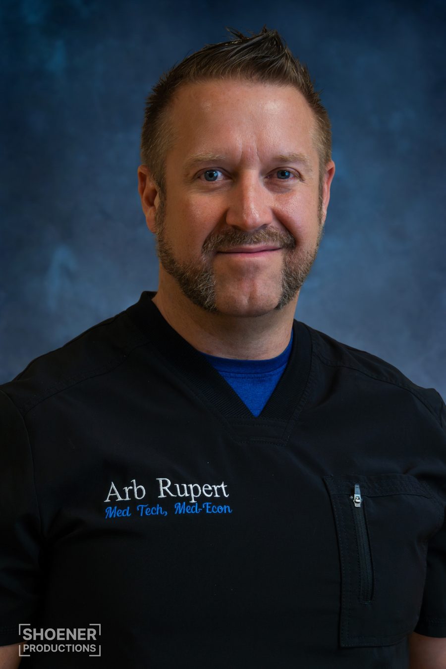 Portrait of a med tech in black scrubs